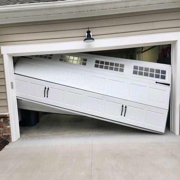 Six Simple Steps to Fix an Off-Track Garage Door follow BIY.